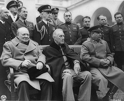 Seated from left to right: Churchill (UK), Roosevelt (USA), Stalin (USSR)